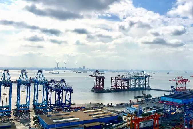The image shows a wide angle shot of ZPMC on the quayside