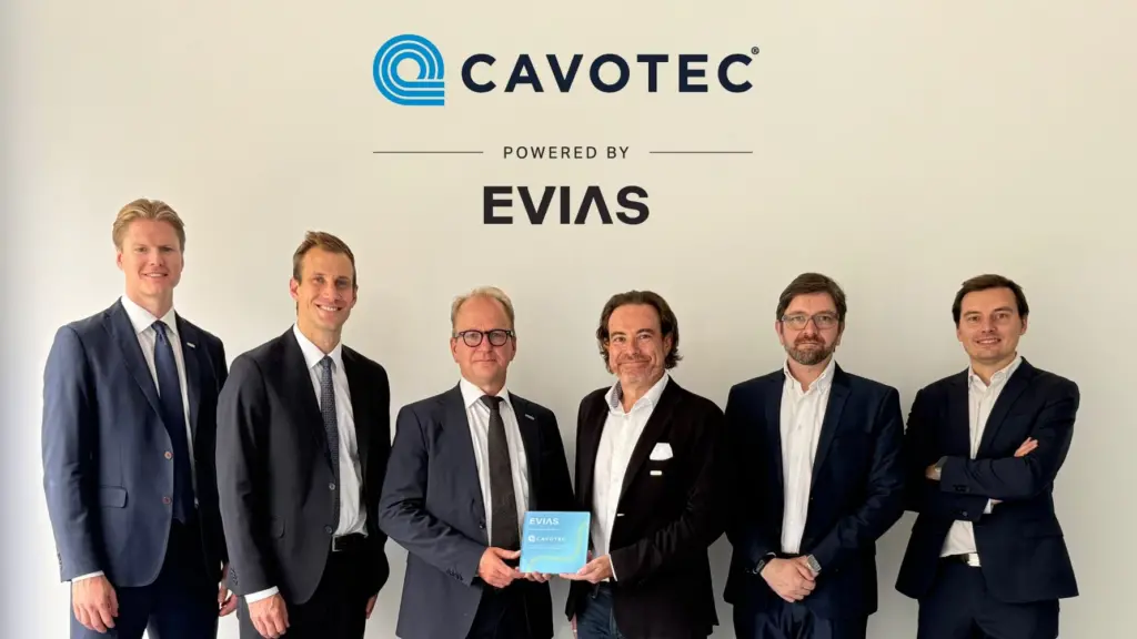 Members of Cavotec and EVIAS at a signing ceremony to mark a partnership deploying electric charging at ports