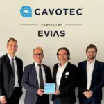 Members of Cavotec and EVIAS at a signing ceremony to mark a partnership deploying electric charging at ports