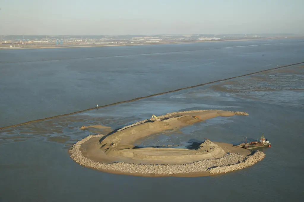 The value of the new port infrastructure must be weighed against the natural capital of the surrounding ecosystem. The Ilot bird island sanctuary at the mouth of the Seine near Le Havre Port 2000 was created to compensate for natural habitats lo...