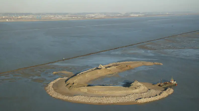 The value of the new port infrastructure must be weighed against the natural capital of the surrounding ecosystem. The Ilot bird island sanctuary at the mouth of the Seine near Le Havre Port 2000 was created to compensate for natural habitats lo...