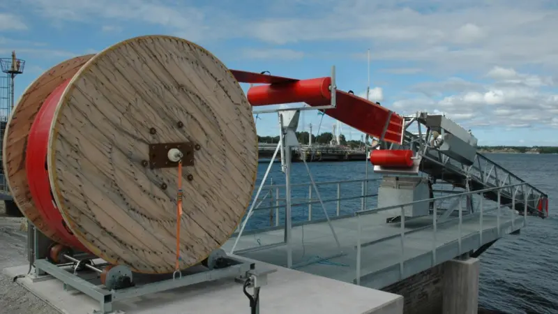 Poised for action: the robotic oil boom is ready for instant deployment