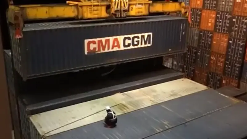 Dockworker on dramatically dangerous twistlock operation: courtesy of YouTube