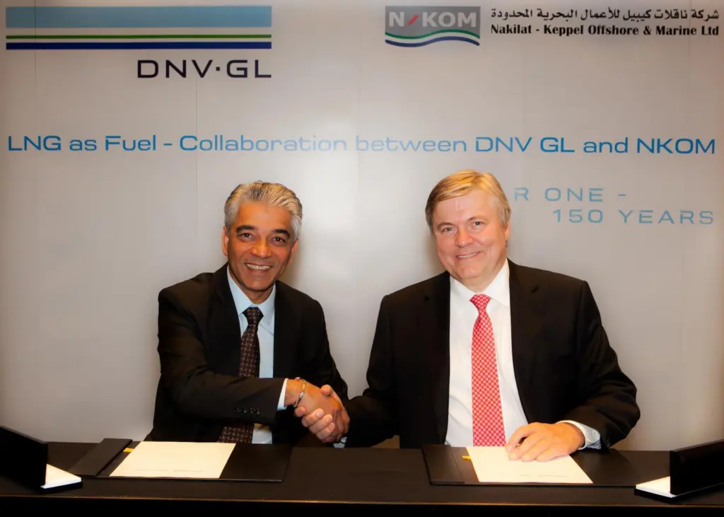 Chandru Rajwani of N-KOM and Henrik Madsen of DNV GL sign the MOU in Dubai