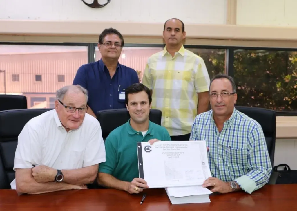 First row (L to R) John Hutchins, principal, Harbor Consulting Engineers; Tucker Gilliam, vice president, Crowley; Humberto Reynolds, president, Del Valle Group. Second row: Carmelo Calderon, vice president, infrastructure division, Del Valle Gr...