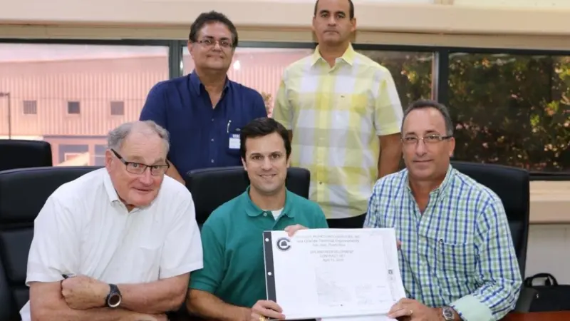 First row (L to R) John Hutchins, principal, Harbor Consulting Engineers; Tucker Gilliam, vice president, Crowley; Humberto Reynolds, president, Del Valle Group. Second row: Carmelo Calderon, vice president, infrastructure division, Del Valle Gr...