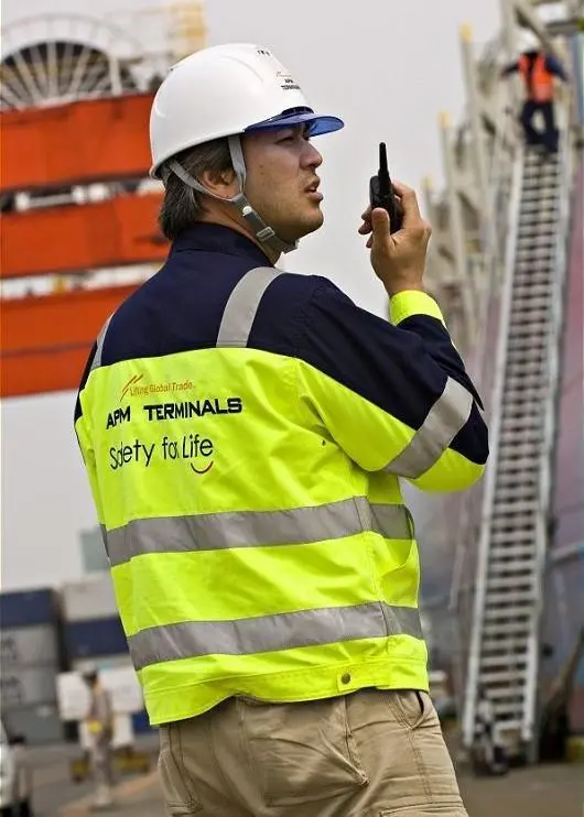 A port worker in a high-visbility jacket.