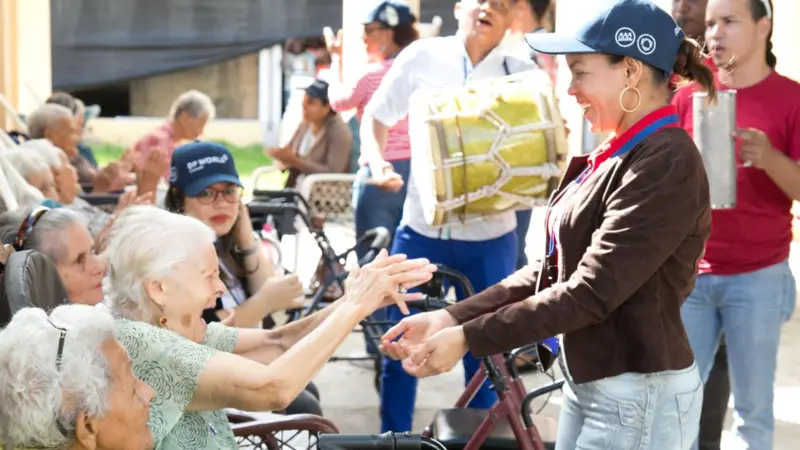 In the Dominican Republic, volunteers visit a home for elderly people