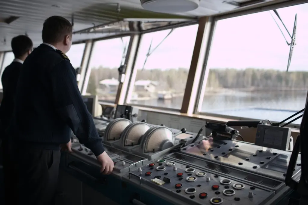 Interior shot of bridge crew onboard a vessel.