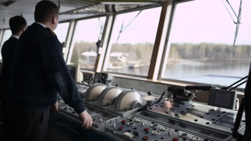 Interior shot of bridge crew onboard a vessel.