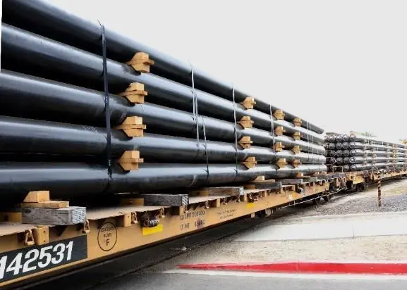 Pilings arriving by train