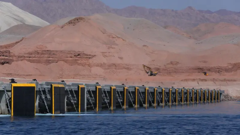 An array of fenders across a port.