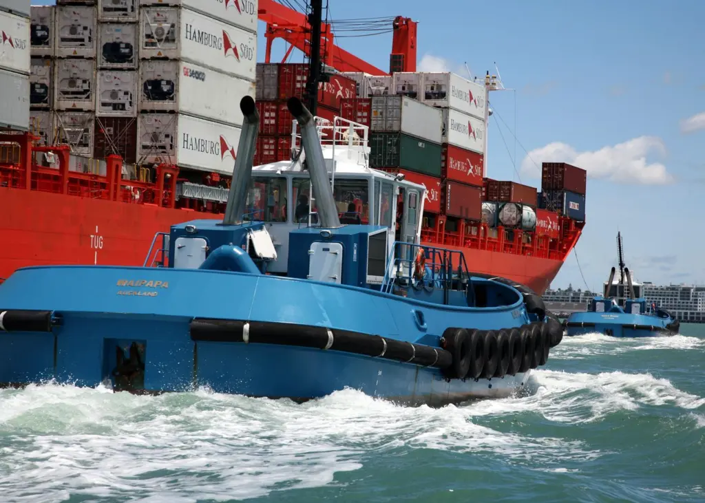 Tugboats assisting a ship in Auckland