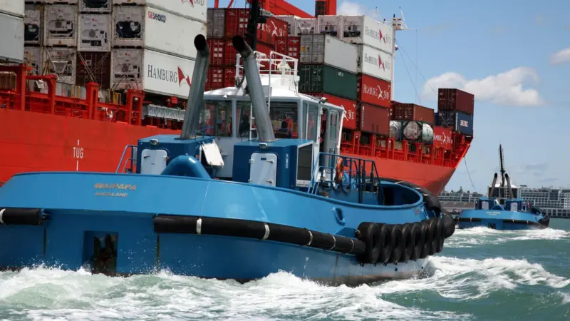 Tugboats assisting a ship in Auckland