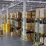 warehouse-with-stacked-boxes-and-pallet-truck-drivers