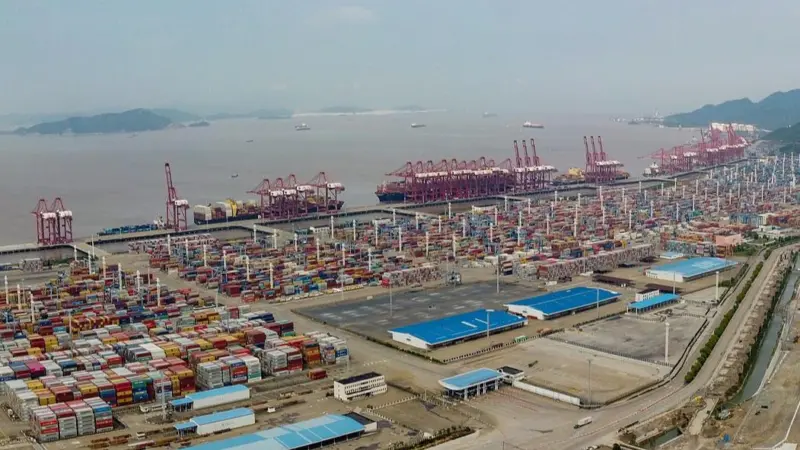 The image shows an aerial picture of the Port of Ningbo-Zhoushan