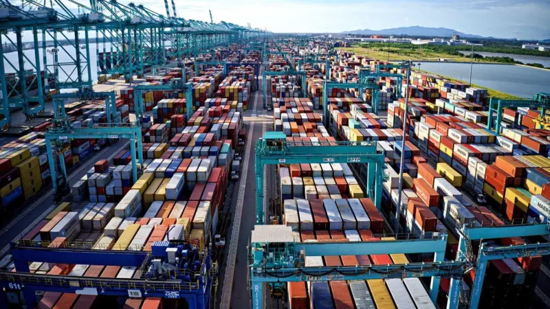 The image shows an aerial view of The Port of Tanjung Pelepas