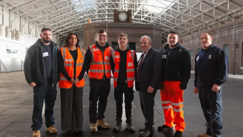 Maritime Minister Mike Kane (third from right) with Forth Ports apprentices and graduates in the historic Tilbury railway station at the Port of Tilbury