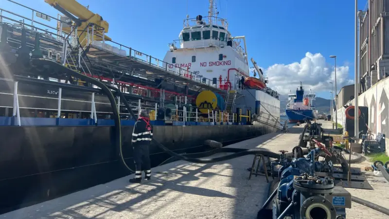 Fuel being supplied to a ship at the Port of Ceuta