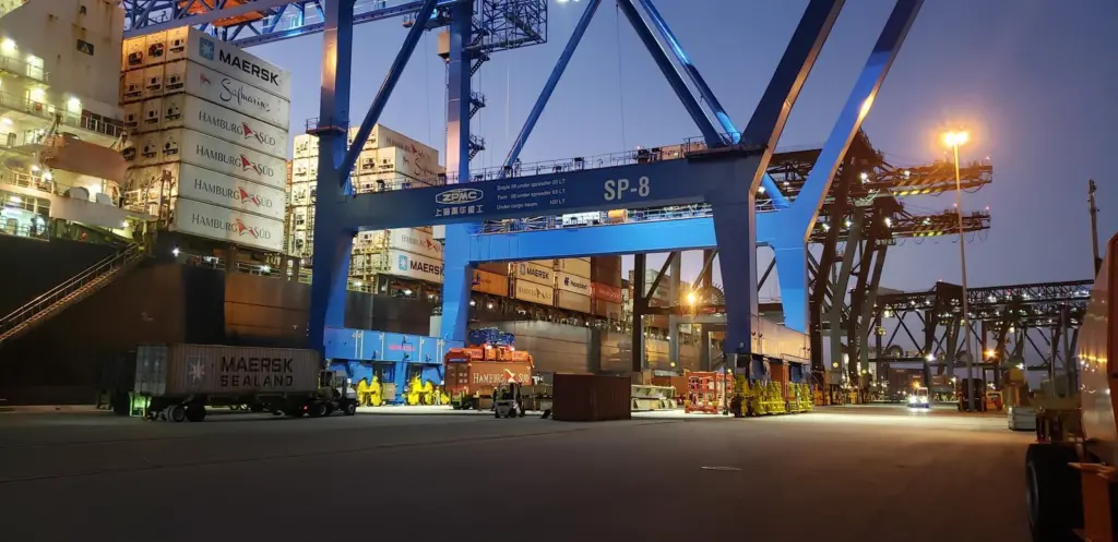 Florida International Terminal at night showing a crane and cargo containers