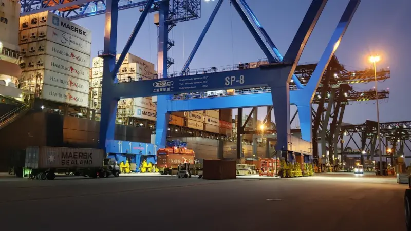 Florida International Terminal at night showing a crane and cargo containers