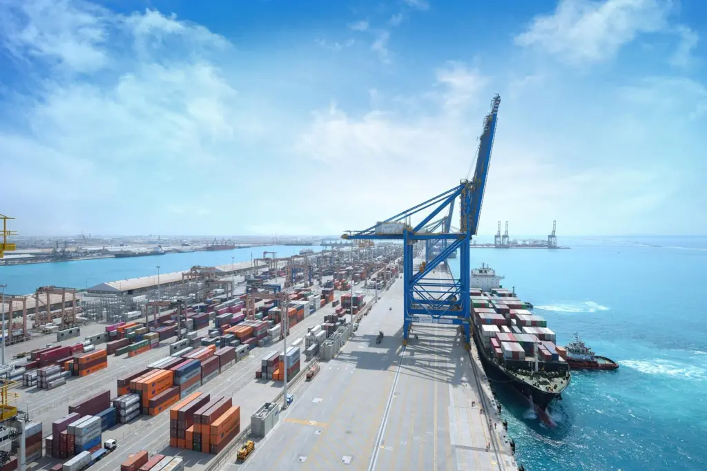 AI image of Jeddah South Container Terminal showing containers, a ship dockside and a crane