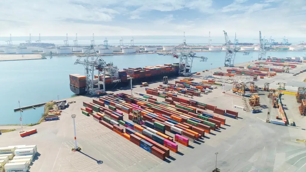 aerial shot of CNMP LH Atlantique with containers portside and cranes loading a cargo ship