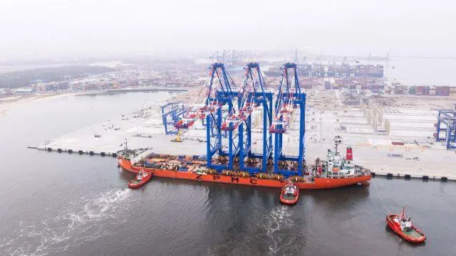 Three ship-to-shore cranes on board a ZPMC carrier arriving at the Baltic Hub in Gdansk
