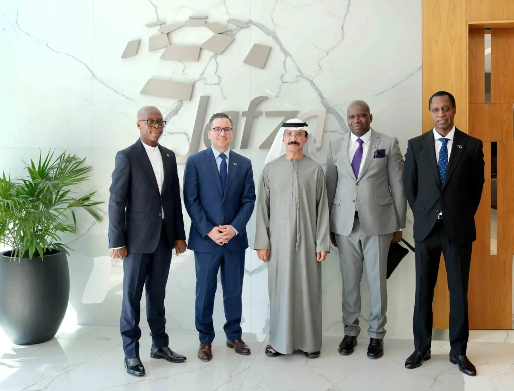 Five members of DP World/Mota-Engil celebrating a new contract to develop Banana Port in the DRC
