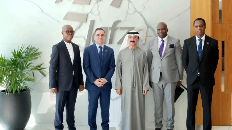 Five members of DP World/Mota-Engil celebrating a new contract to develop Banana Port in the DRC