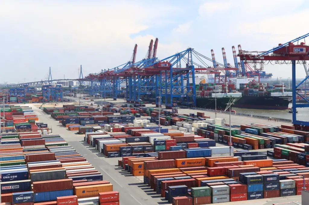 The image shows containers on a quayside in Germany
