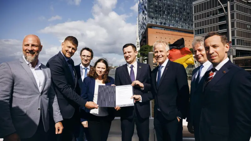Representatives from Germany and Latvia at an MoU signing ceremony