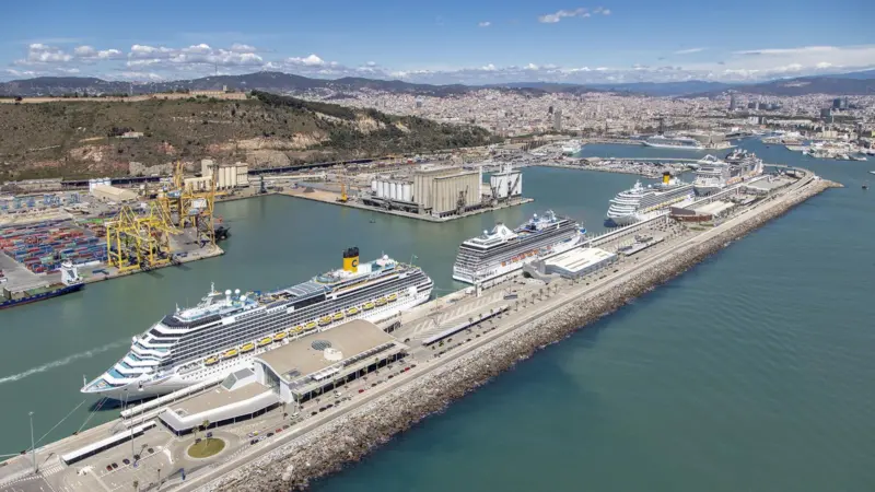 Aerial shot of the Port of Barcelona showing four cruise ships at dock