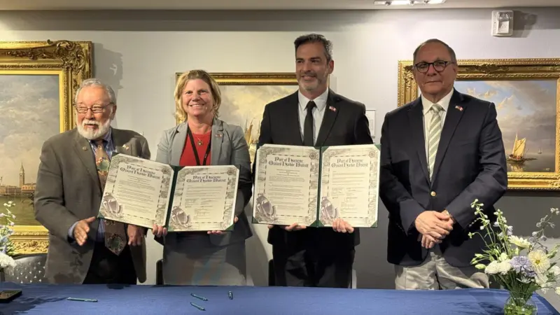 The ports’ CEOs and board members celebrate the MOU