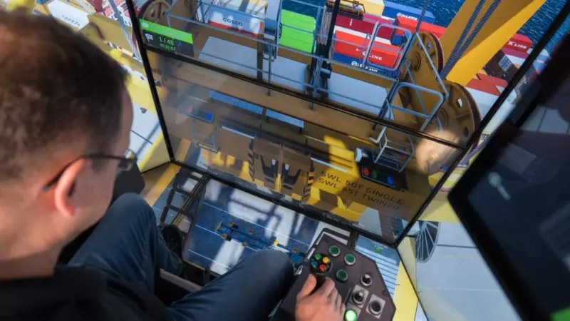 The image shows an operator undertaking CMLabs MasterCab STS crane simulator training