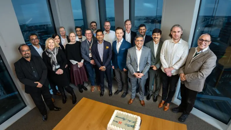 Employees of Kalmar and TCS celebrating a new deal to upgrade IT services