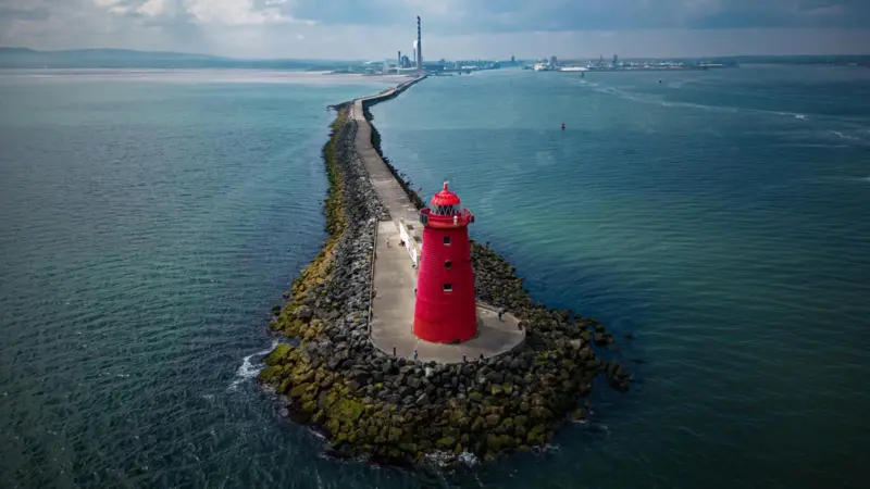 Great South Wall Dublin Port with red lighthouse at the end