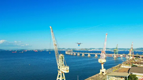 a drone being used to deliver equipment to ships