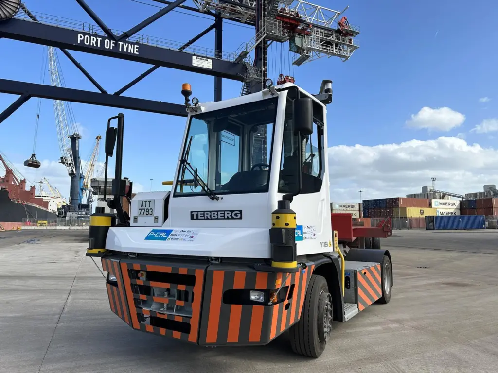 An autonomous terminal tractor driven by Oxa’s self-driving technology, shown quayside at Port of Tyne