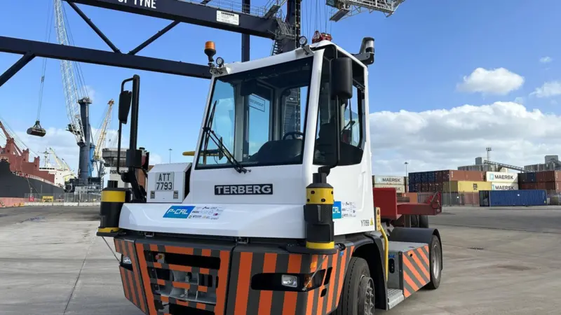 An autonomous terminal tractor driven by Oxa’s self-driving technology, shown quayside at Port of Tyne