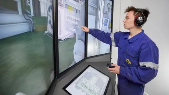 A young worker looking at a screen