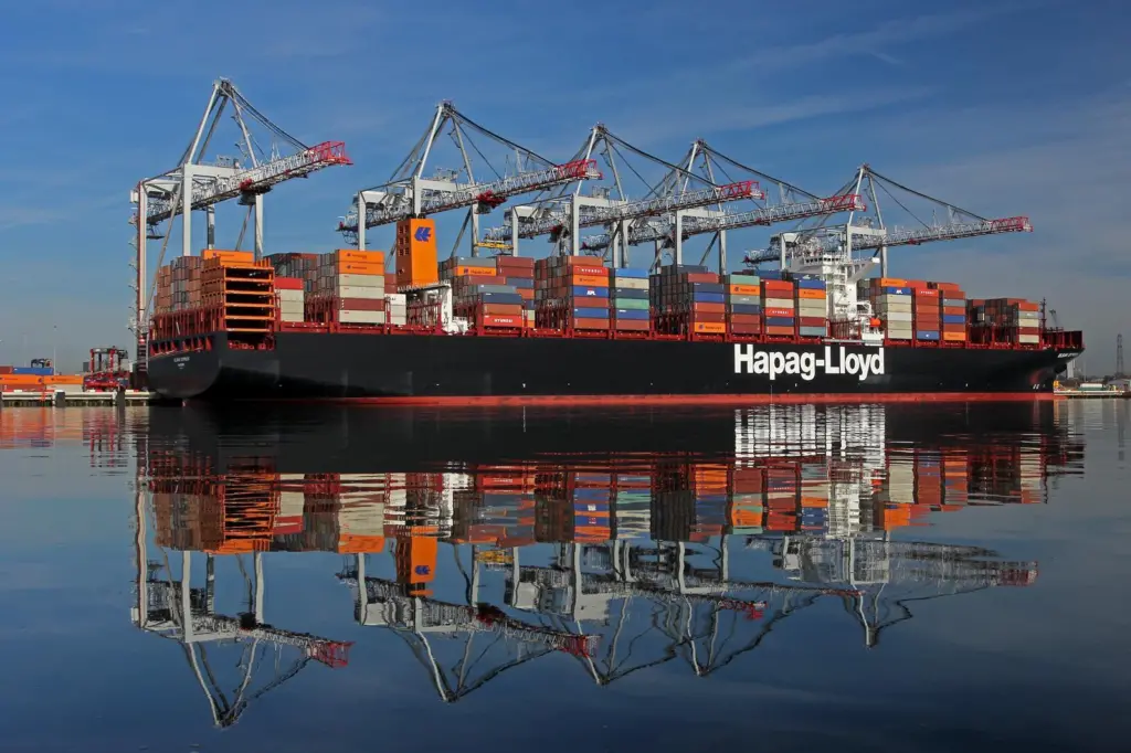 Hapag-Lloyd container ship at the Port of Southampton with five ship-to-shore cranes in the background