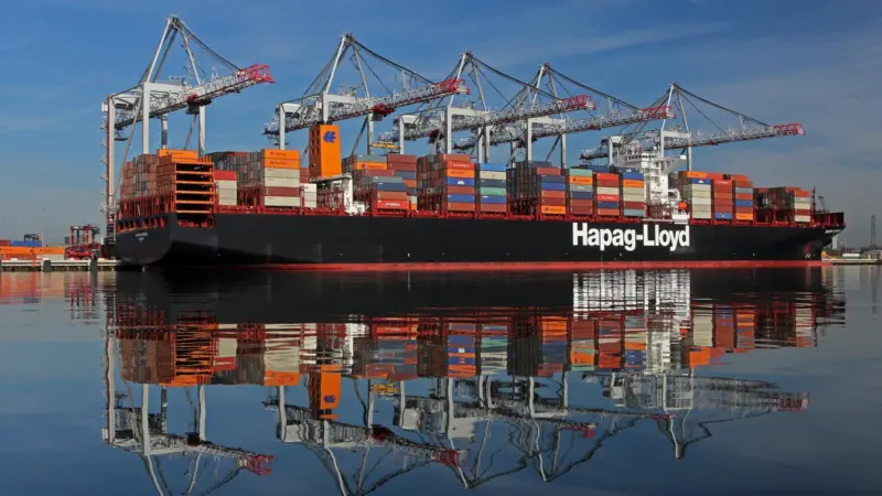 Hapag-Lloyd container ship at the Port of Southampton with five ship-to-shore cranes in the background