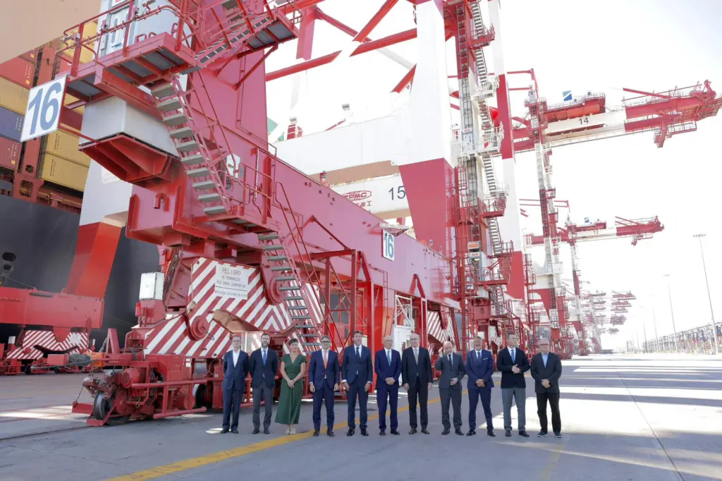 Representatives from BEST standing in front of a new ship-to-shore cranes at the Port of Barcelona